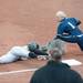 Iowa's Kikki Gentile safe at third as Michigan senior Amy Knapp tries to tag her out during the second inning of their game at Alumni field Saturday, April 20.
Courtney Sacco I AnnArbor.com